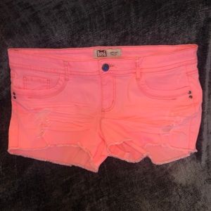 Bright pink/orange cut off shorts